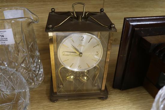 A wall clock and a mantel clock